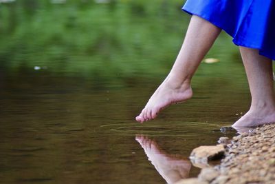 Low section of woman in water