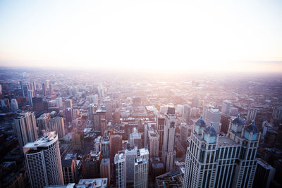 High angle view of buildings in city against clear sky