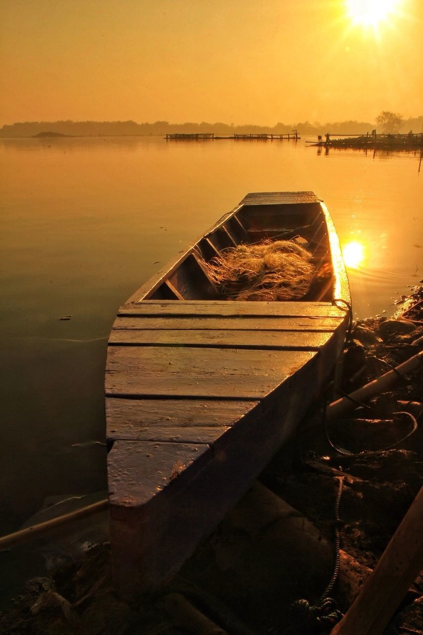 sunset, water, transportation, nautical vessel, boat, mode of transport, moored, reflection, sea, orange color, sky, scenics, tranquility, tranquil scene, nature, beauty in nature, sun, lake, sunlight, river