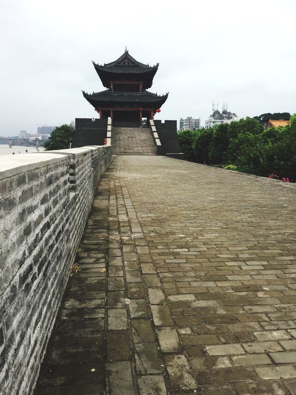 built structure, architecture, sky, building exterior, sea, water, the way forward, history, day, outdoors, religion, travel destinations, incidental people, tranquility, stone material, famous place, spirituality, tourism, footpath, cobblestone