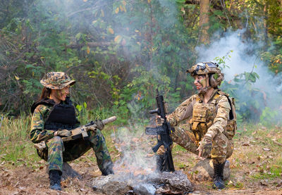 Female soldiers rest after training hard