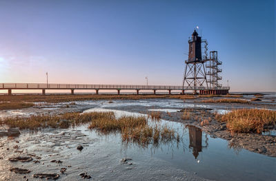 Tower bridge over water during winter
