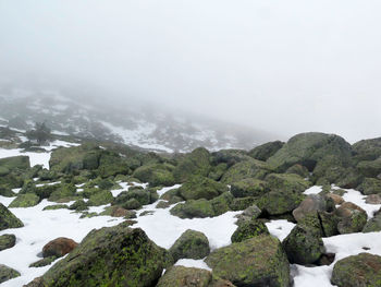 Scenic view of mountains against sky during winter