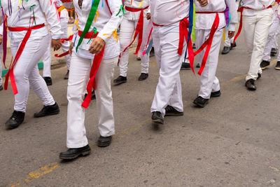 Low view of members of the marujada de curaca dancing during the chegancas meeting parade 