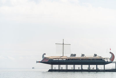 Pier on sea against sky