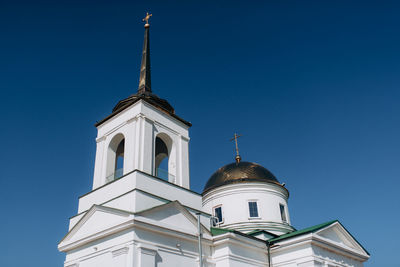 Low angle view of building against clear blue sky
