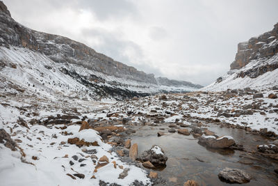 Scenic view of snowcapped mountains against sky