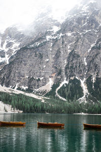 Scenic view of lake by snowcapped mountains