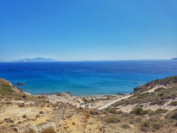 Scenic view of sea against clear blue sky