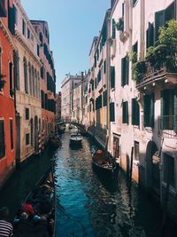 Canal amidst buildings in city