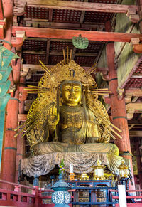 Statue of temple in building