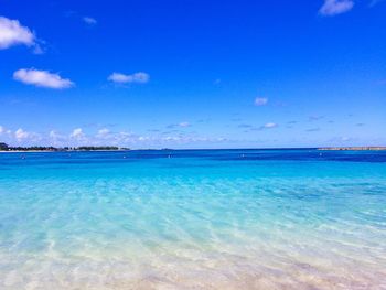 Scenic view of sea against blue sky