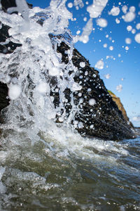 Close-up of water splashing in sea