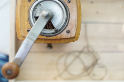 Close-up of machine part on table