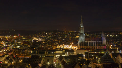 Illuminated buildings in city at night