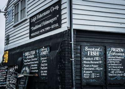 Low angle view of information sign in city