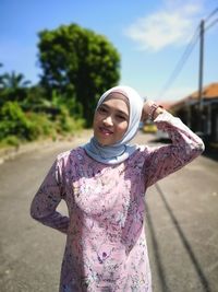 Woman wearing mask standing outdoors