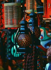 Close-up of illuminated lanterns hanging in market