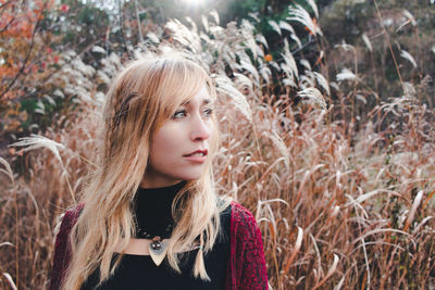 Close-up portrait of young woman standing outdoors