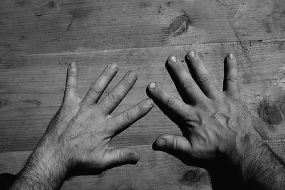 Close-up of hands on table