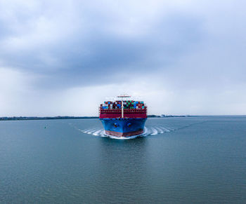 View of ship in sea against sky