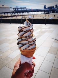 Hand holding ice cream cone