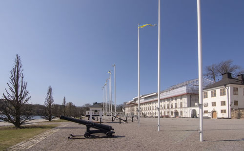 Street against clear blue sky