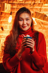 Portrait of smiling young woman in winter