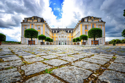 View of old building against cloudy sky