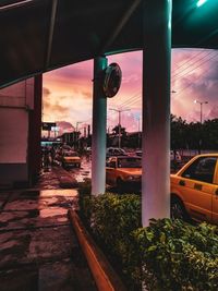 Car on street against sky during sunset