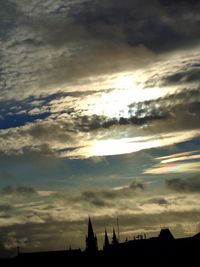 Low angle view of dramatic sky over city