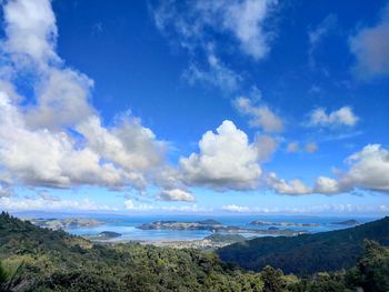 Scenic view of landscape against blue sky