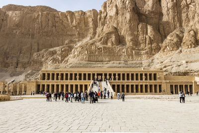 Group of people in front of ancient building