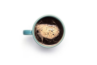 High angle view of coffee cup against white background