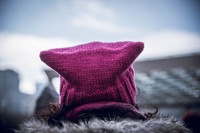 Rear view of woman wearing knit hat