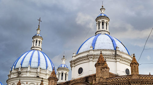 Low angle view of cathedral and buildings against sky