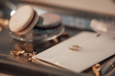 Close-up of wedding rings on table