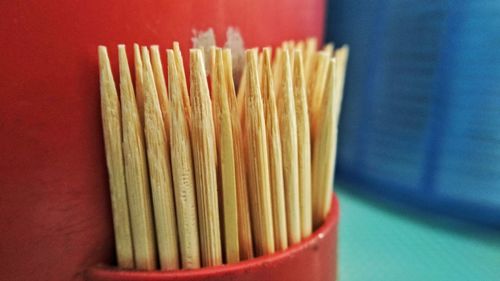 Close-up of toothpicks in container