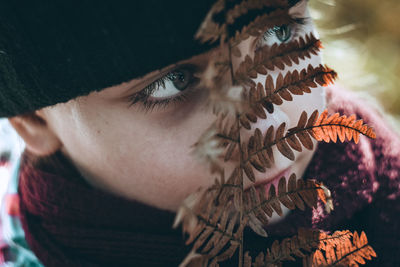 Close-up portrait of young woman looking away