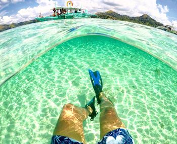 High angle view of man swimming in sea