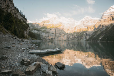 Scenic view of lake against cloudy sky