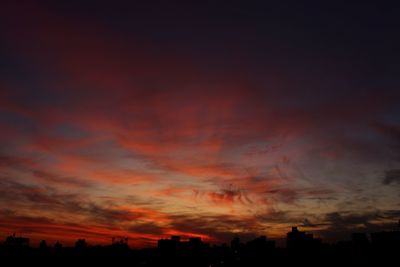 Dramatic sky over city during sunset