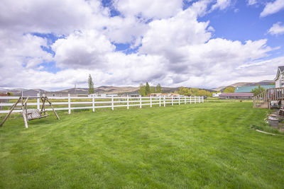 View of soccer field against cloudy sky