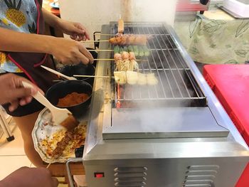 Midsection of person preparing food