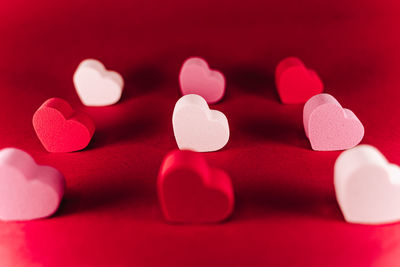 Close-up of heart shape against red background