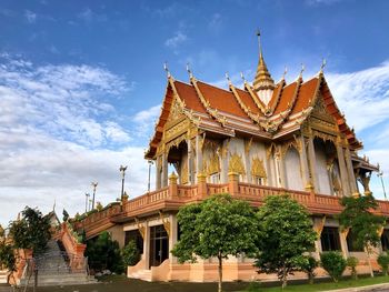 View of temple building against cloudy sky