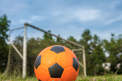 Close-up of soccer ball on field