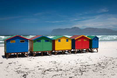 Beach huts against sky