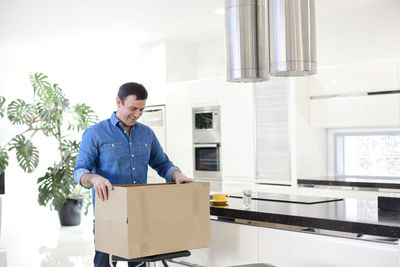 Side view of man working at home