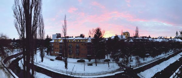 Panoramic view of cityscape against sky during winter